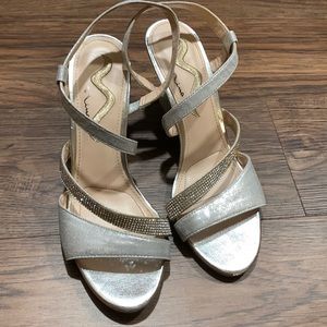 Nine rhinestone heels. Size 8. Rhinestones tarnished a little on left side